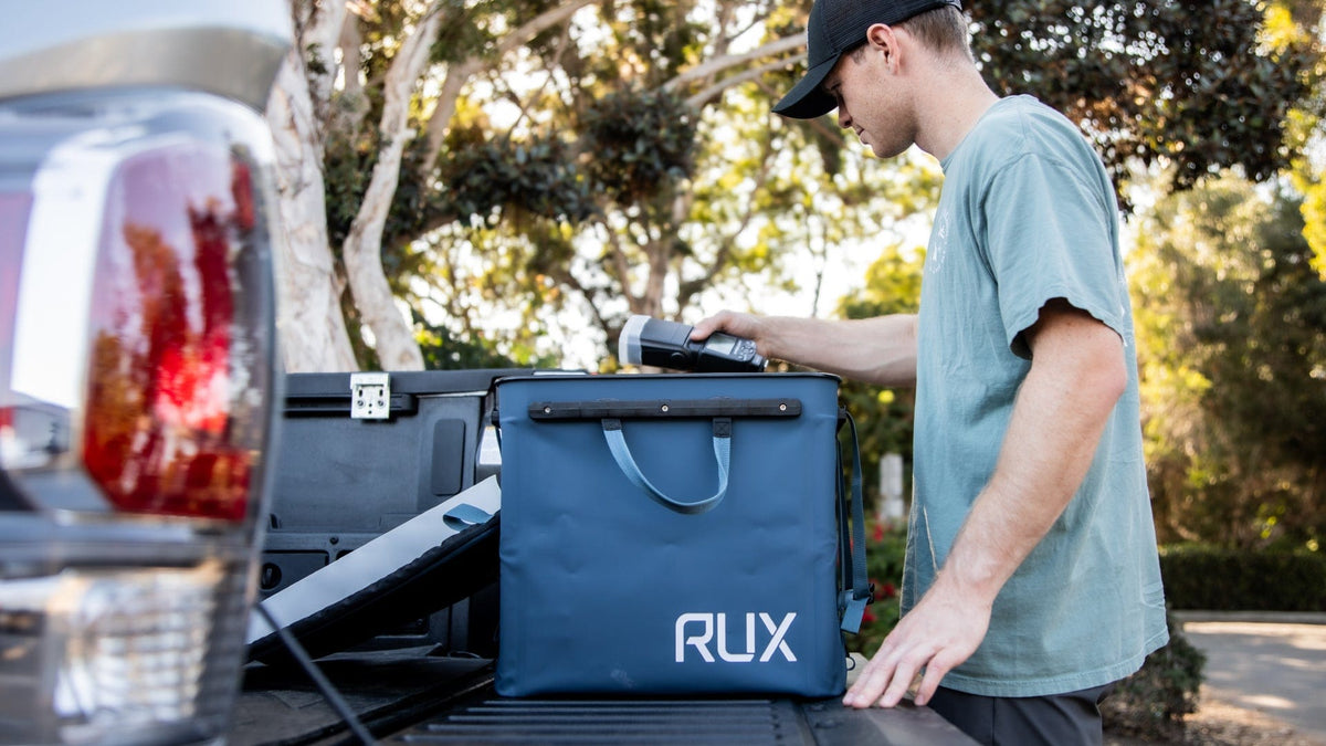 Blue RUX 70L in a pickup truck